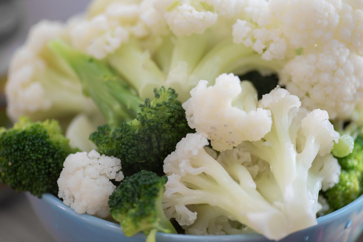 Top steamed and cooled broccoli and cauliflower with a tahini, soy, and stevia dressing.